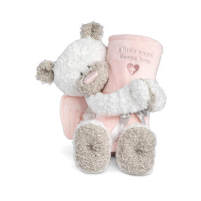 A white and brown teddy bear with pink angel wings holding a soft pink rolled blanket that says "A little angel sleeps here".