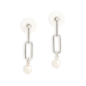 A pair of silver metal hanging earrings with a small pearl attached at the bottom.