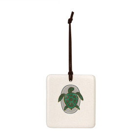 A square hanging tile ornament with a graphic image of a green turtle on a gray background.