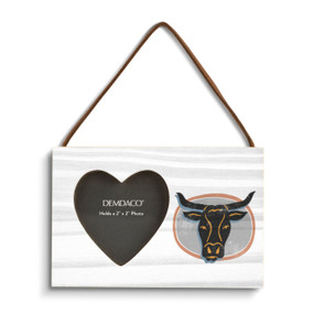 A rectangular hanging white wood frame ornament with a graphic image of a longhorn and a 2x2 heart shaped opening for a photo.