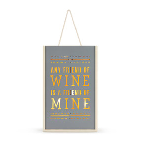 An illuminated gray and light wood tall box that says "Any Friend of Wine is a Friend of Mine" cut out of the wood that holds two bottles of wine, with a rope handle.