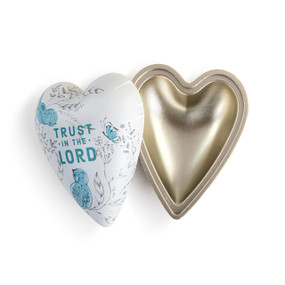 A white heart shaped keeper box with line drawn bluebirds and florals that says "Trust in the Lord", displayed with the lid off showing the inside of the box.