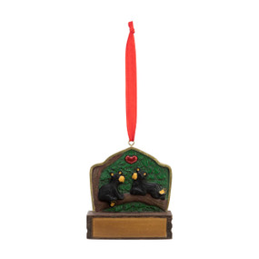 An ornament of two black bears sitting on a limb with a red heart over them, hanging from a red ribbon. There is a spot in front for customization.