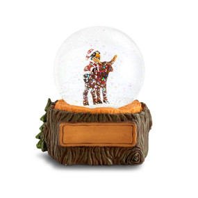 A musical snow globe with a figure of a black bear dressed as Santa riding on the back of a reindeer. The base looks like a tree stump with a place to personalize on the front.