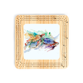 A light wood cribbage board with a watercolor image of sea turtles in the middle.
