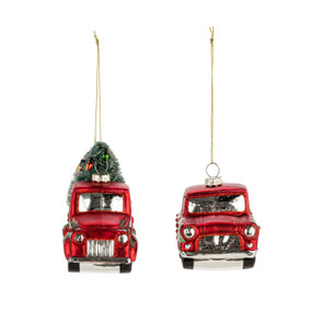 A set of two different blown glass red truck ornaments. One has a Christmas tree on top.