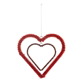 A heart shaped ornament made of two different sized strings of red and dark red beads, one inside the other.