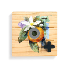 A square wood board for tic tac toe with a watercolor image of an orange blossom, displayed with a gray O and black X on top.