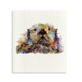 A white biodegradable dish cloth with a watercolor image of an otter.