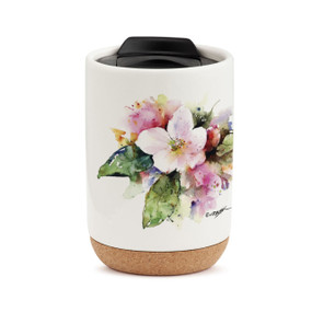 A white travel mug with a cork base, a black lid, and a watercolor image of an apple blossom.