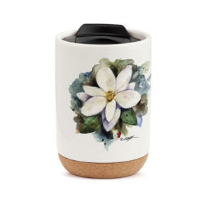 A white travel mug with a cork base, a black lid, and a watercolor image of a white magnolia.