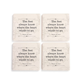 A set of four cream square ceramic coasters that say "The feet always know where the heart wants to go" with the hundred acre wood lightly in the background.