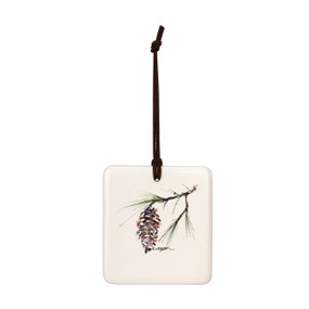 A square cream hanging tile magnet ornament with a watercolor image of a white pine branch.
