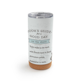 A white cork bottom tumbler with a clear plastic lid. The tumbler has Pooh's Guide for a Good day on the shore with the hundred acre wood lightly in the background.