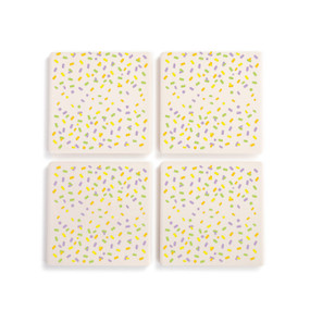 A set of four square ceramic coasters with a colorful confetti pattern.
