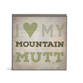 A small square brown wall art with the saying "I love my mountain mutt".