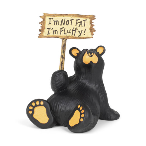 A sitting black bear figurine holding a sign that says "I'm Not Fat I'm Fluffy!".