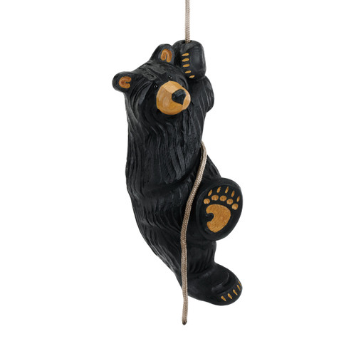 Black bear figurine climbing a brown rope