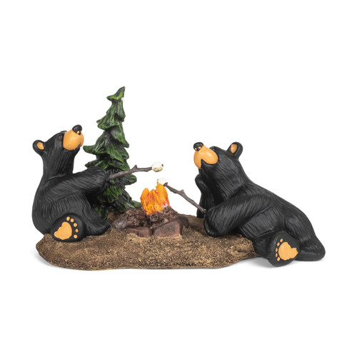 A figurine of two black bears sitting around a campfire toasting marshmallows over a campfire.