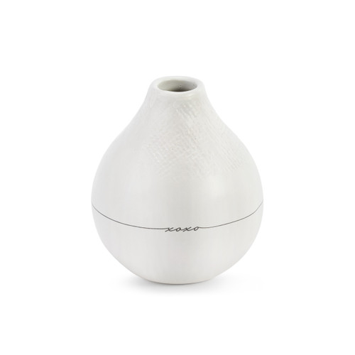 A white textured vase with "xoxo" in black lettering.