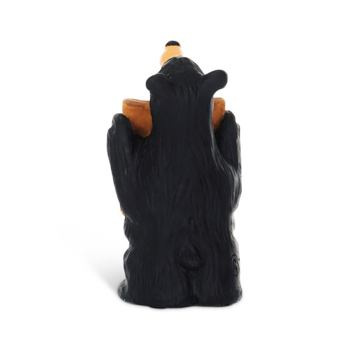 Back view showing a figurine of a standing black bear holding a "Free Bear Hugs" sign.