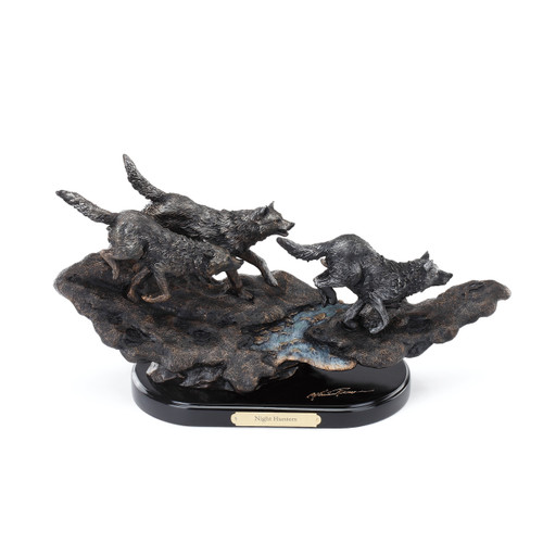 Dark grey wolves chasing each other figurine with night hunters in gold plaque