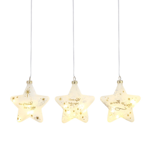 Four lit star ornaments with gold stars and gold Christmas messages.