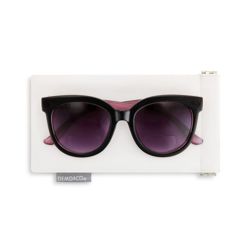 A +2.00 power pair of black and pink reading sunglasses placed on a white sleeve.