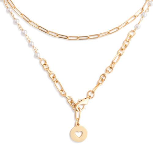 A gold wrap necklace/bracelet with various pearl white beads, and a circular pendant with a heart shape cutout.