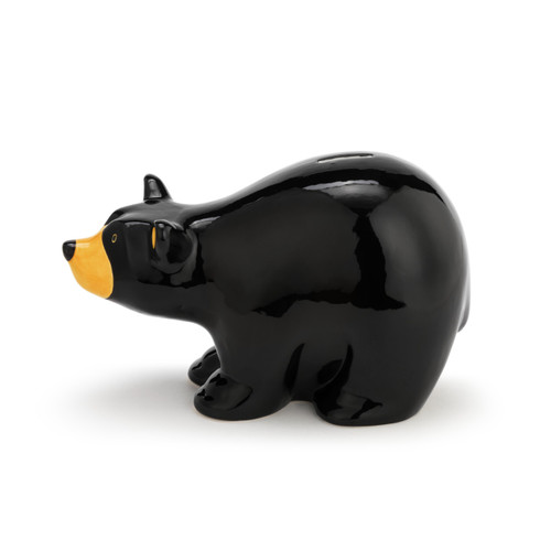 A left facing view of a black bear coin bank.