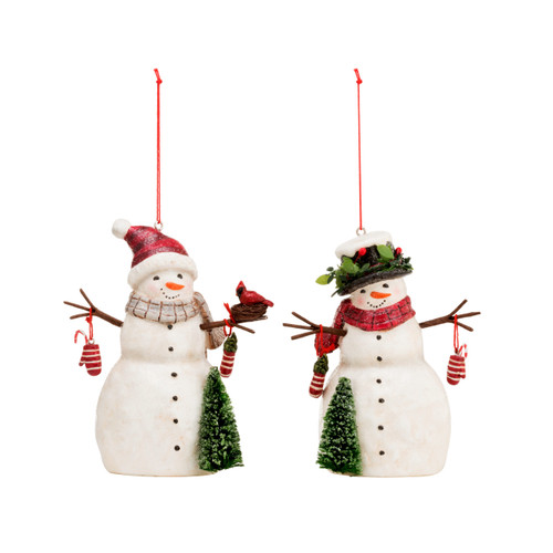 A set of two white snowmen ornaments, one holding a nested red cardinal, one wearing a black top hat. Each holding two red and white striped mittens and a tree. With a red string.