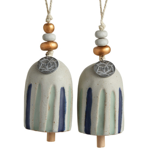 A set of two small, cream Inspired Bells" with light green and dark blue stripes, a twine rope, and gold and wooden beads. Each with a silver pendant that reads "friends"."