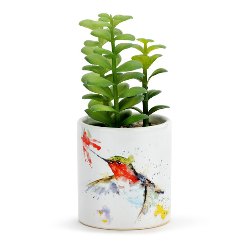 A white ceramic planter with a watercolor hummingbird and flower with a green artificial succulent inside the planter.