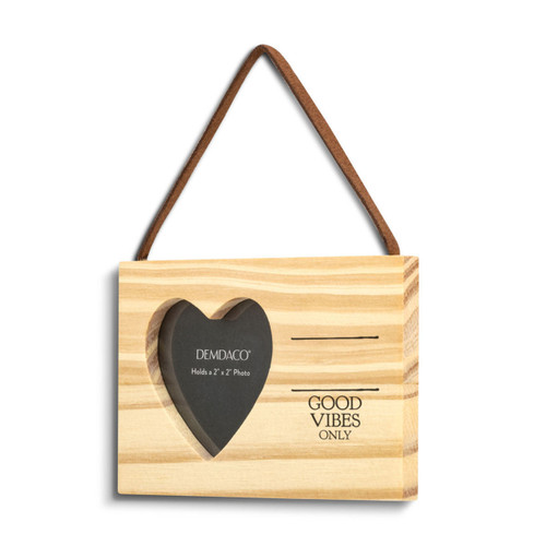 A rectangular hanging wood ornament with a heart shaped two inch photo opening next to the saying "Good Vibes Only" under two black lines with room for personalization, displayed angled to the left.