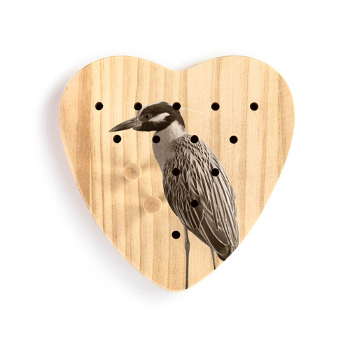 A heart shaped wood peg game that has the image of a heron, shown with two wood pegs in it.