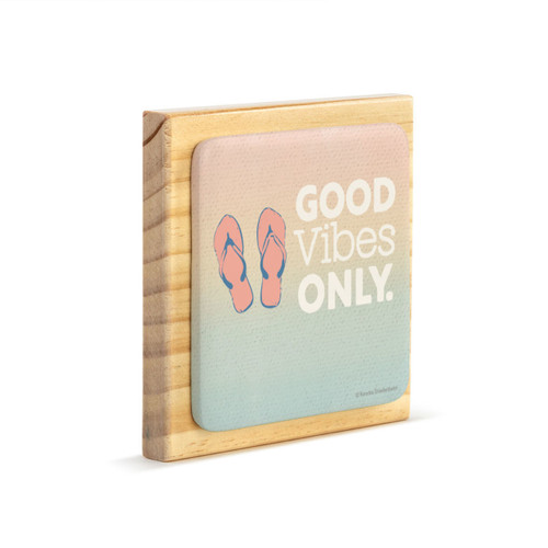 A square wood plaque with a tile attached with an image of flip flops and says "Good Vibes Only" angled to the right.