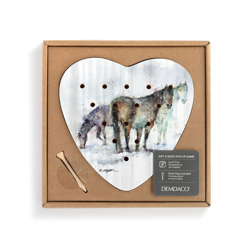 A heart shaped wood peg game with a watercolor painting of three horses, displayed in a packaging box with a product information tag attached.