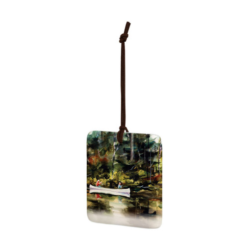 A square hanging ornament with a watercolor image of a canoe on the water, displayed angled to the left.