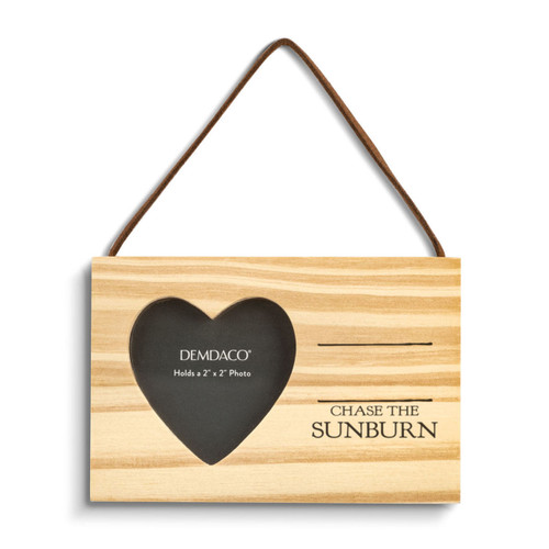 A rectangular hanging wood ornament with a heart shaped two inch photo opening next to the saying "Chase the Sunburn" under two black lines with room for personalization.