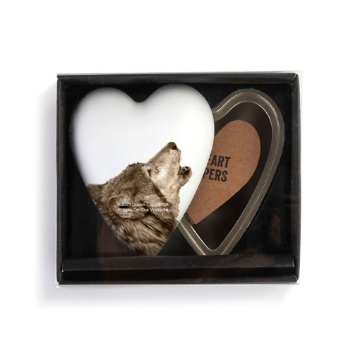 A heart shaped container with a wolf on a white background, shown with the lid offset to the base in a packaging box.