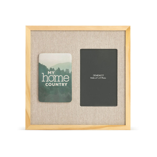 A light wood frame with a tile on the left with a green mountain scene that says "My Home Country" next to a 4x6 photo opening with a linen mat.
