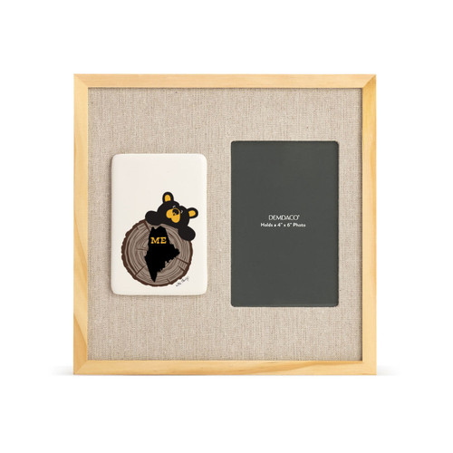 A light wood frame with a tile on the left that has a drawn black bear looking over a tree stump with the state of Maine on it next to a 4x6 photo opening with a linen mat.