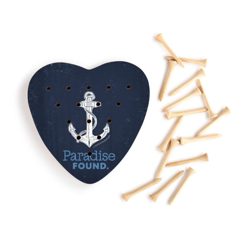 A dark blue heart shaped wood peg game with a white anchor and the words "Paradise Found" next to a set of wood pegs.