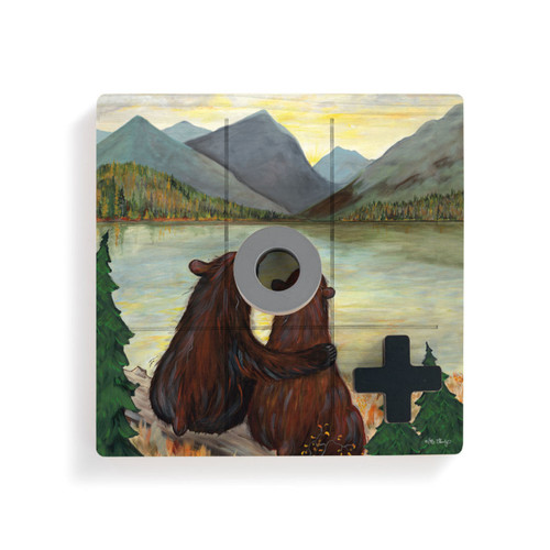 A square wood tic tac toe board with a painted image of two black bears watching a sunset, with a gray O and black X on top.