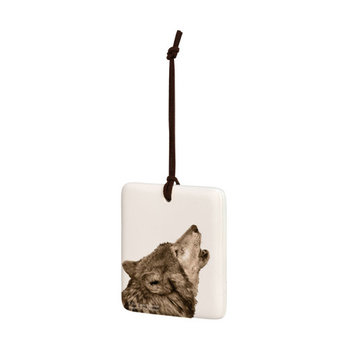 A white square tile hanging ornament with the image of a howling wolf, displayed angled to the left.
