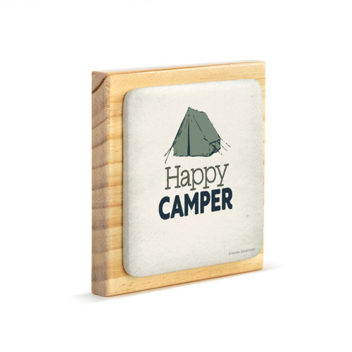 A square wood plaque with a cream tile attached that has a green tent and says "Happy Camper" angled to the right.