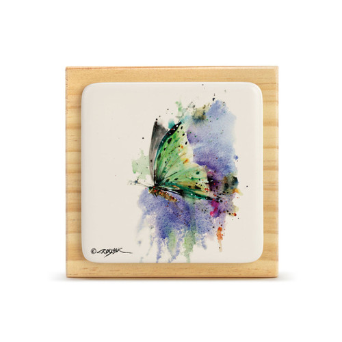 A square wood plaque with a tile attached that has a watercolor image of a green butterfly.