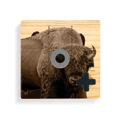 A square wood board for tic tac toe with an image of a bison, shown with a gray O and black X on top.