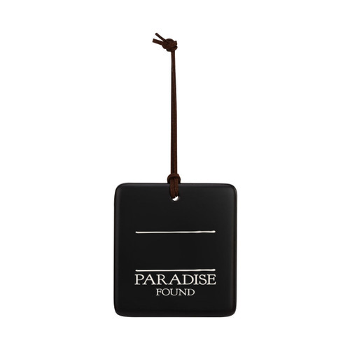 A square black hanging ornament that says "Paradise Found" in white under two white lines with room for personalization.