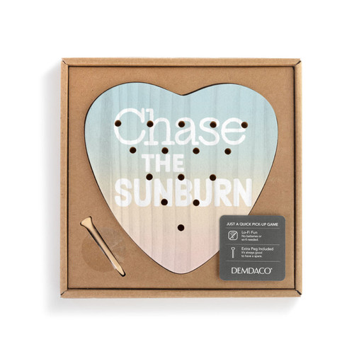 A sunset colored heart shaped wood peg game that says "Chase the Sunburn", displayed in a packaging box with a product information tag.
